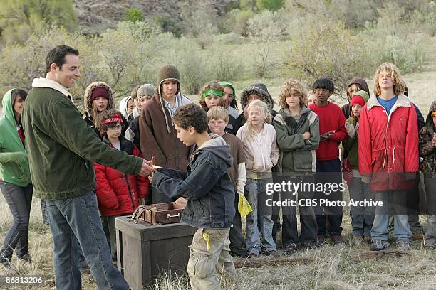 The Pioneers look on as host Jonathan Karsh awards Zach the Gold Star on the season finale of KID NATION, broadcast Wednesday, Dec. 12 on CBS.