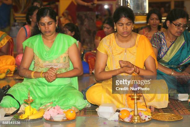 Tamil Hindu women participate in special prayers during Varalaxmi Pooja at a Tamil Hindu temple in Toronto, Ontario, Canada. Varalaxmi Pooja is...