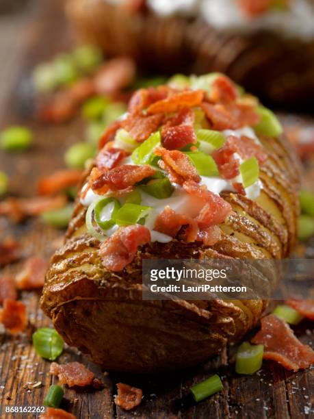 loaded hasselback potatoes - stuffed potato stock pictures, royalty-free photos & images