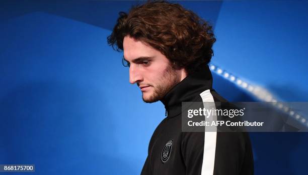 Paris Saint-Germain's French midfielder Adrien Rabiot arrives for a press conference at the Parc des Princes stadium in Paris on October 30, 2017 on...