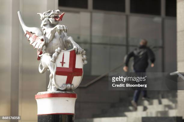 City of London Dragon' statue stands atop a bollard in the City of London, U.K., on Monday. Oct. 30, 2017. The Bank of England may raise interest...