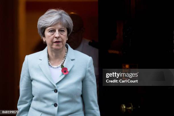 Prime Minister Theresa May leaves 10, Downing Street for the House of Commons on October 30, 2017 in London, England. Following allegations of sexual...