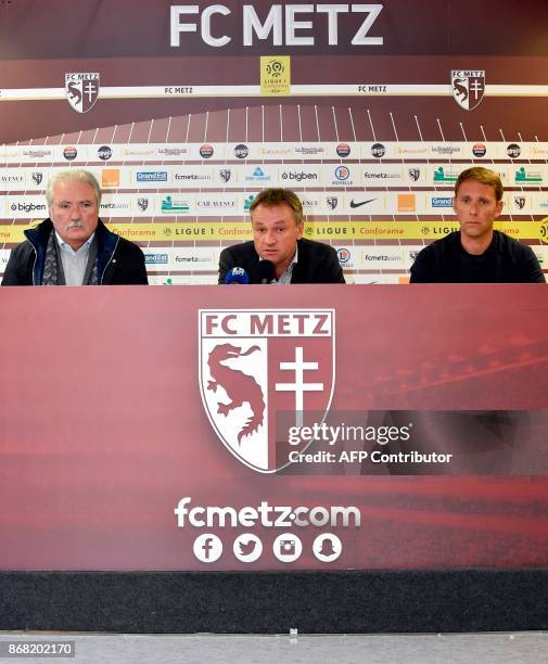 Metz's newly appointed French head-coach Frederic Hantz , flanked by Metz's president Bernard Serin and Metz's assistant coach Arnaud Cormier , gives...