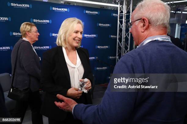 Senator Kirsten Gillibrand talks with guests after a SiriusXM "Town Hall" event with host Zerlina Maxwell at the SiriusXM studios on October 30, 2017...