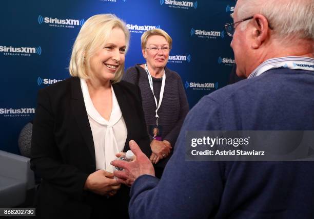 Senator Kirsten Gillibrand talks with guests after a SiriusXM "Town Hall" event with host Zerlina Maxwell at the SiriusXM studios on October 30, 2017...