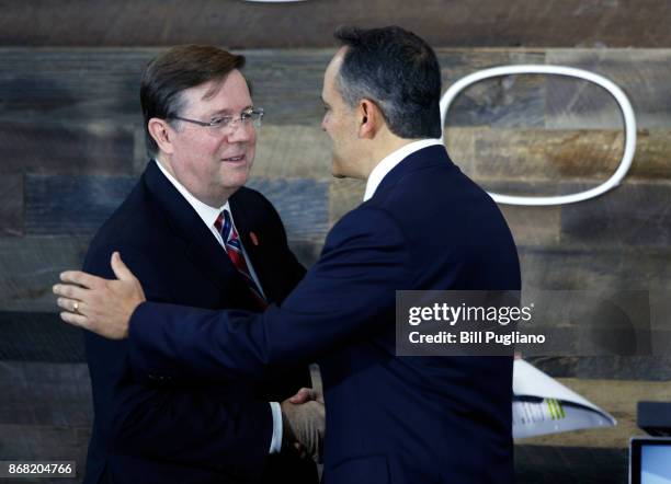 Toyota CEO Jim Lentz shakes hands with and Kentucky Governor Matt Bevin at the unveiling of a new $80 million Toyota engineering headquarters October...