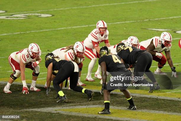 Nebraska Cornhuskers quarterback Tanner Lee takes a snap during the Big Ten conference game between the Purdue Boilermakers and the Nebraska...