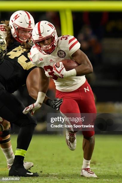 Nebraska Cornhuskers running back Jaylin Bradley finds a seam in the Purdue Boilermakers defense during the Big Ten conference game between the...
