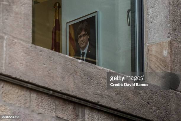 Portrait of the deposed President of Catalonia Carles Puigdemont hangs on a wall inside the Catalan Government building, Palau de la Generalitat, on...