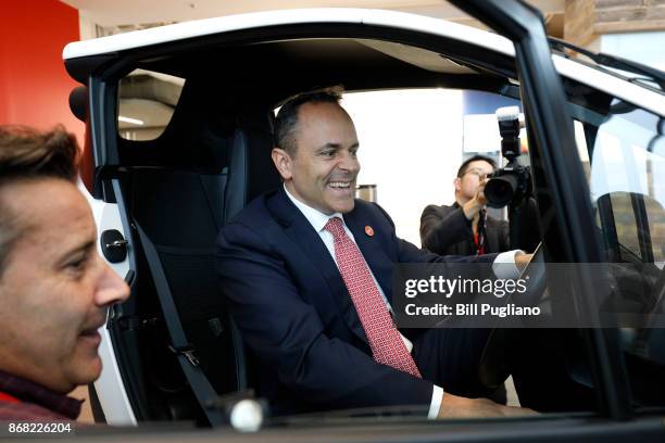 Kentucky Governor Matt Bevin sits in a Toyota I-Road after the unveiling of a new Toyota engineering headquarters October 30, 2017 in Georgetown,...