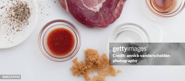 marinating pork cutlets. - sunflower seed oil stock pictures, royalty-free photos & images