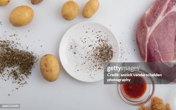 marinating pork cutlets. - sunflower seed oil stock pictures, royalty-free photos & images