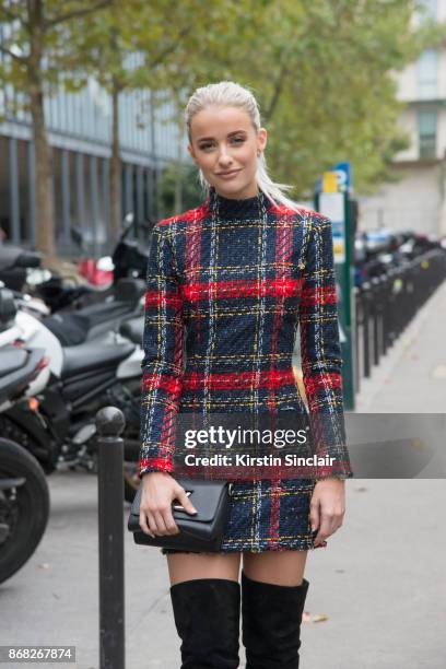 Fashion blogger at InTheFrow Victoria Magrath wears a Balmain dress, Louis Vuitton bag and Gianvito Rossi boots day 3 of Paris Womens Fashion Week...