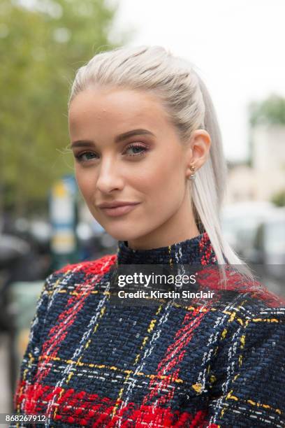 Fashion blogger at InTheFrow Victoria Magrath wears a Balmain dress day 3 of Paris Womens Fashion Week Spring/Summer 2018, on September 28, 2017 in...