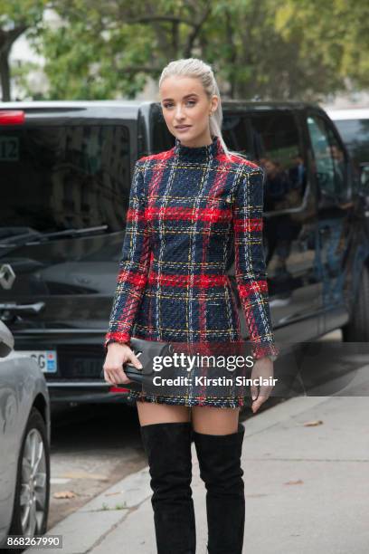 Fashion blogger at InTheFrow Victoria Magrath wears a Balmain dress, Louis Vuitton bag and Gianvito Rossi boots day 3 of Paris Womens Fashion Week...