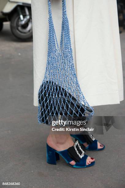 Fashion stylist and consultant Kate Foley Osterweis wears a Carven skirt and Miu Miu shoes day 3 of Paris Womens Fashion Week Spring/Summer 2018, on...