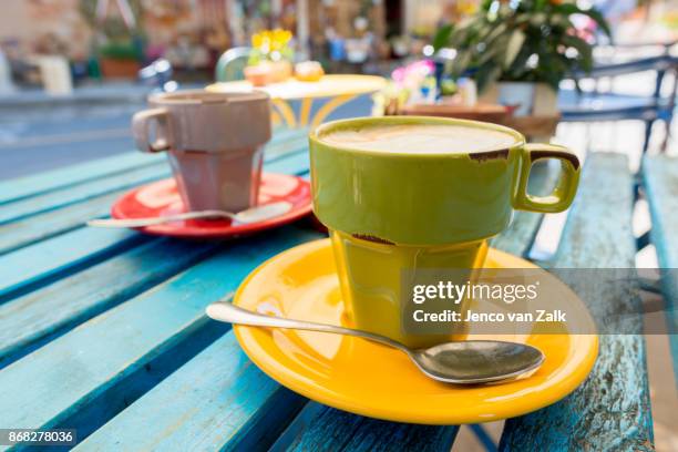 cappuccini on the terras - jenco van zalk stock pictures, royalty-free photos & images