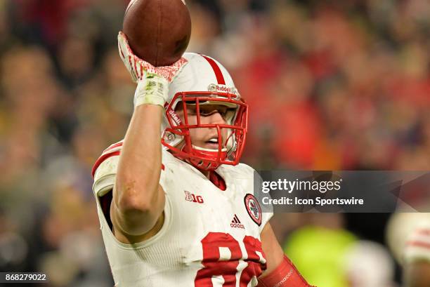 Nebraska Cornhuskers tight end Tyler Hoppes tosses the ball to an official during the Big Ten conference game between the Purdue Boilermakers and the...
