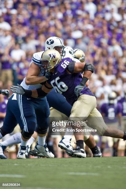 Washington defensive end Daniel Te'o-Nesheim rounds Brigham Young's offense during their football game in Seattle Wa.