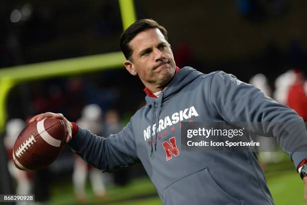 Nebraska Cornhuskers defensive coordinator Bob Diaco throws the ball to a player during warm ups for the Big Ten conference game between the Purdue...
