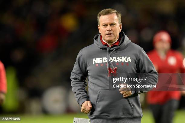 Nebraska Cornhuskers Executive Director of Player Personnel Billy Devaney jogs to the locker room before the start of the Big Ten conference game...