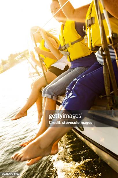 friends sailing - life jacket stock pictures, royalty-free photos & images