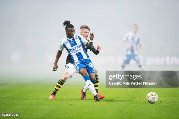 Sam Adekugbe of IFK Goteborg and Robert Taylor of AIK competes for the ballduring the Allsvenskan match between AIK and IFK Goteborg at Friends arena...