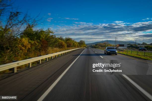 open road and a car - open highway stock pictures, royalty-free photos & images