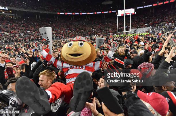 Ohio State Buckeyes mascot Brutus Buckeye celebrates with fans at Ohio Stadium on October 28, 2017 in Columbus, Ohio. Ohio State defeated Penn Statte...