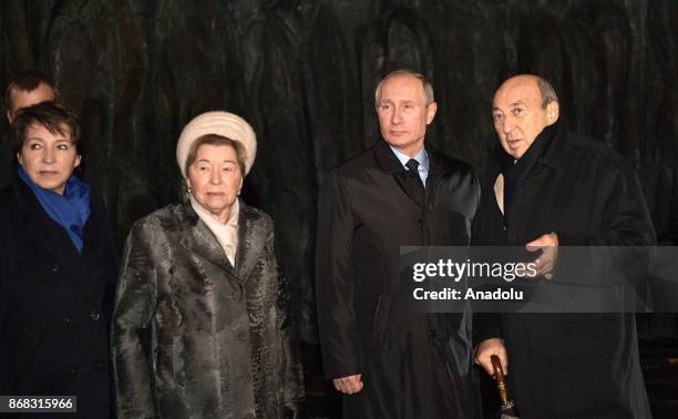 Boris Yeltsin's daughter Tatyana Yumasheva and his widow Naina , Russia's President Vladimir Putin and sculptor Georgy Frangulyan attend the...