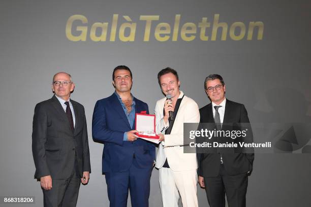 Carlo Brancaleoni, Edoardo De Angelis, Francesco Fachinetti and guests attend Telethon Gala during the 12th Rome Film Fest at Villa Miani on October...