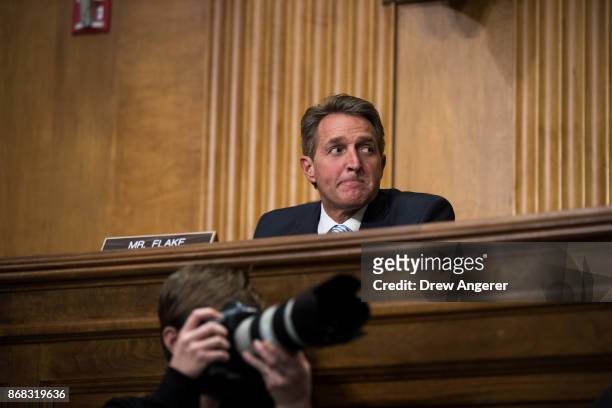 Sen. Jeff Flake looks on during a Senate Foreign Relations Committee hearing concerning the authorizations for use of military force, October 30,...