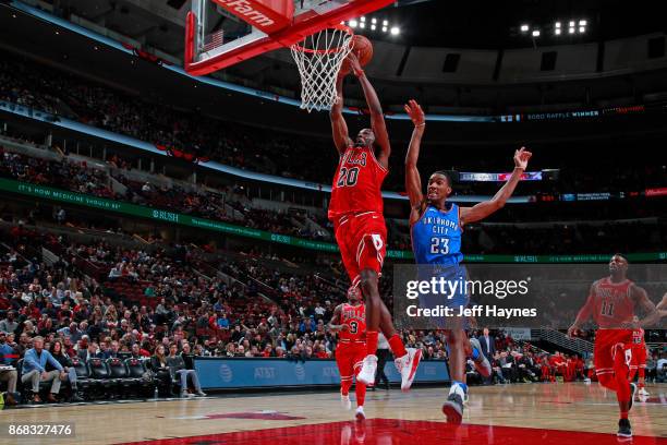 Quincy Pondexter of the Chicago Bulls goes up for a dunk against the Oklahoma City Thunder on October 28, 2017 at the United Center in Chicago,...