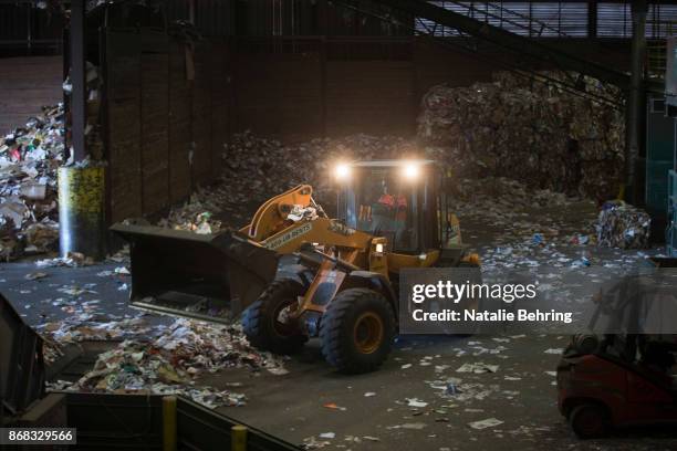 Bulldozer moves paper and plastic waste at Far West Recycling October 30, 2017 in Hillsboro, Oregon. For decades, shipping containers have been...