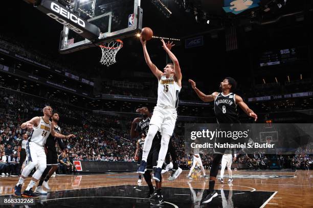 Nikola Jokic of the Denver Nuggets shoots the ball against the Brooklyn Nets on October 29, 2017 at Barclays Center in Brooklyn, New York. NOTE TO...