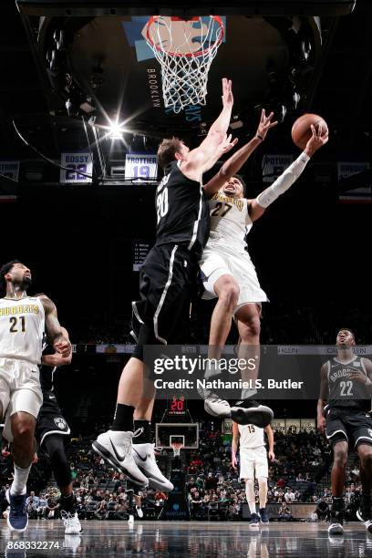 Jamal Murray of the Denver Nuggets goes to the basket against the Brooklyn Nets on October 29, 2017 at Barclays Center in Brooklyn, New York. NOTE TO...