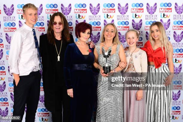 Sharon and Ozzy Osbourne present a special recognition award to Sarah Hope and children Barnaby Pollyanna and Sapphire during The Pride of Britain...