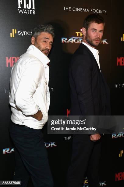 Director Taika Waititi and Chris Hemsworth attend The Cinema Society's Screening Of Marvel Studios' "Thor: Ragnarok" at the Whitby Hotel on October...