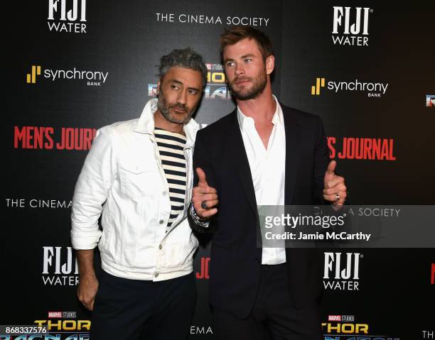 Director Taika Waititi and Chris Hemsworth attend The Cinema Society's Screening Of Marvel Studios' "Thor: Ragnarok" at the Whitby Hotel on October...