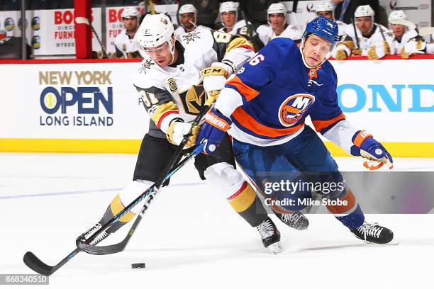 Nikolay Kulemin of the New York Islanders battles for the puck against Jonathan Marchessault of the Vegas Golden Knights at Barclays Center on...