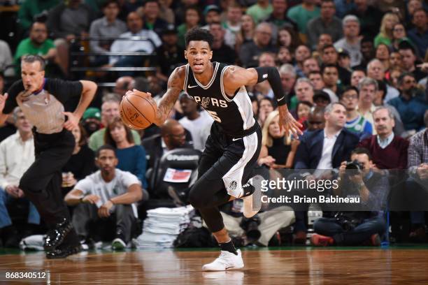 Dejounte Murray of the San Antonio Spurs handles the ball against the Boston Celtics on October 30, 2017 at the TD Garden in Boston, Massachusetts....