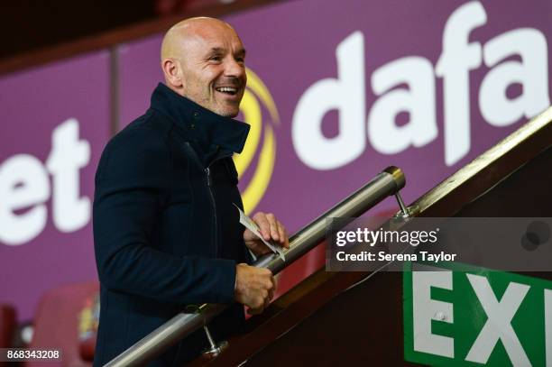 Ex Newcastle United coach Steve Stone laughs during the Premier League match between Burnley and Newcastle United at Turf Moore on October 30 in...