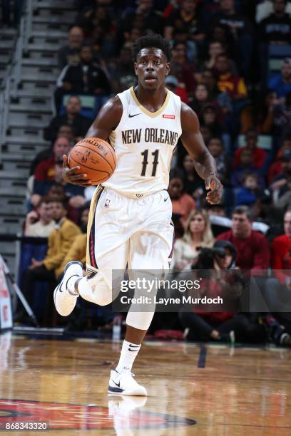 Jrue Holiday of the New Orleans Pelicans handles the ball against the Cleveland Cavaliers on October 28, 2017 at the Smoothie King Center in New...