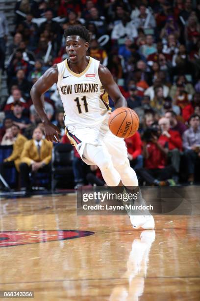 Jrue Holiday of the New Orleans Pelicans handles the ball against the Cleveland Cavaliers on October 28, 2017 at the Smoothie King Center in New...