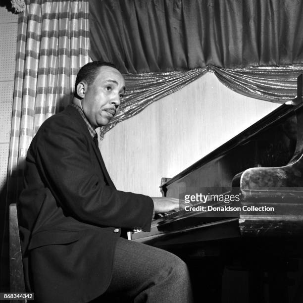 Pianist Red Garland of the Miles Davis Groupo performs onstage on October 18, 1955 in New York.