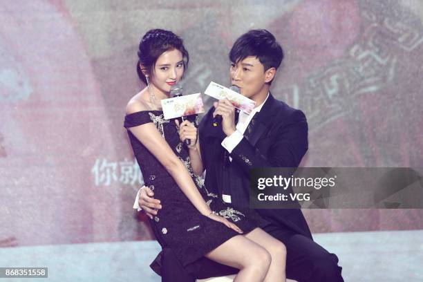 Actor Raymond Lam and actress Tang Yixin attend the press conference of TV series "Rule the World" on October 30, 2017 in Beijing, China.