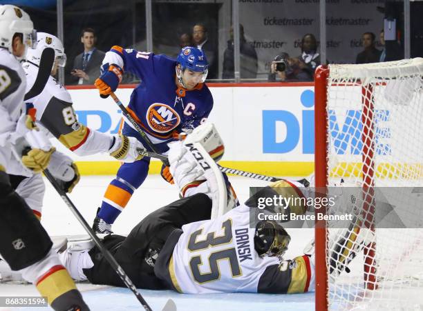 Oscar Dansk of the Vegas Golden Knights blocks the net against John Tavares of the New York Islanders during the second period at the Barclays Center...