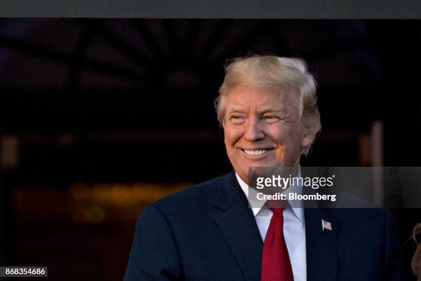 President Donald Trump smiles while hosting a Halloween event on the South Lawn of the White House in Washington, D.C., U.S., on Monday, Oct. 30,...