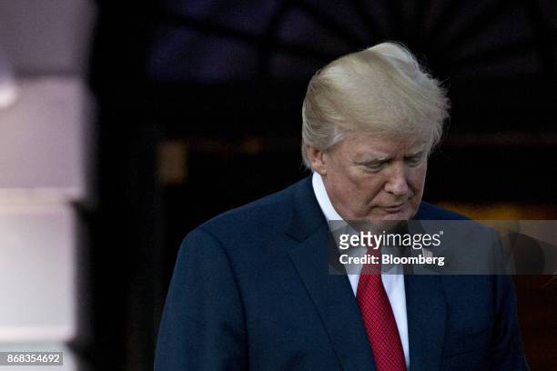 President Donald Trump stands while hosting a Halloween event on the South Lawn of the White House in Washington, D.C., U.S., on Monday, Oct. 30,...