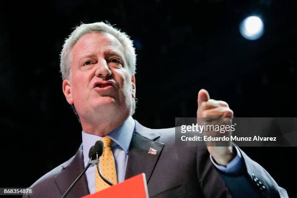 New York City Mayor Bill de Blasio speaks to attendees during a campaign rally with Sen. Bernie Sanders on October 30, 2017 in New York City. New...